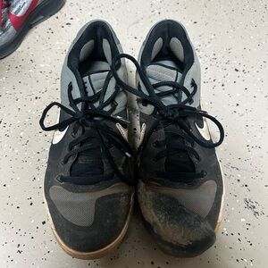 Nike softball cleats with pitchers toe on left foot